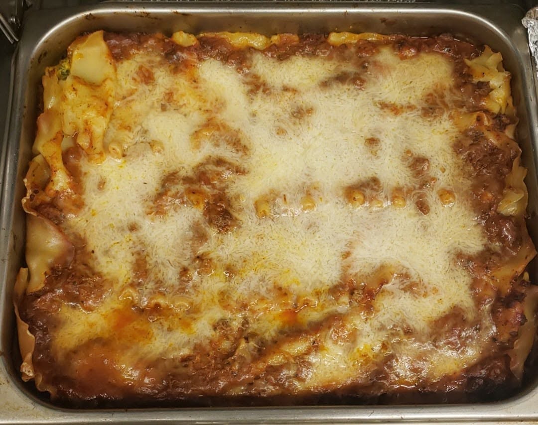 Homemade lasagna with melted cheese at Bev's Restaurant