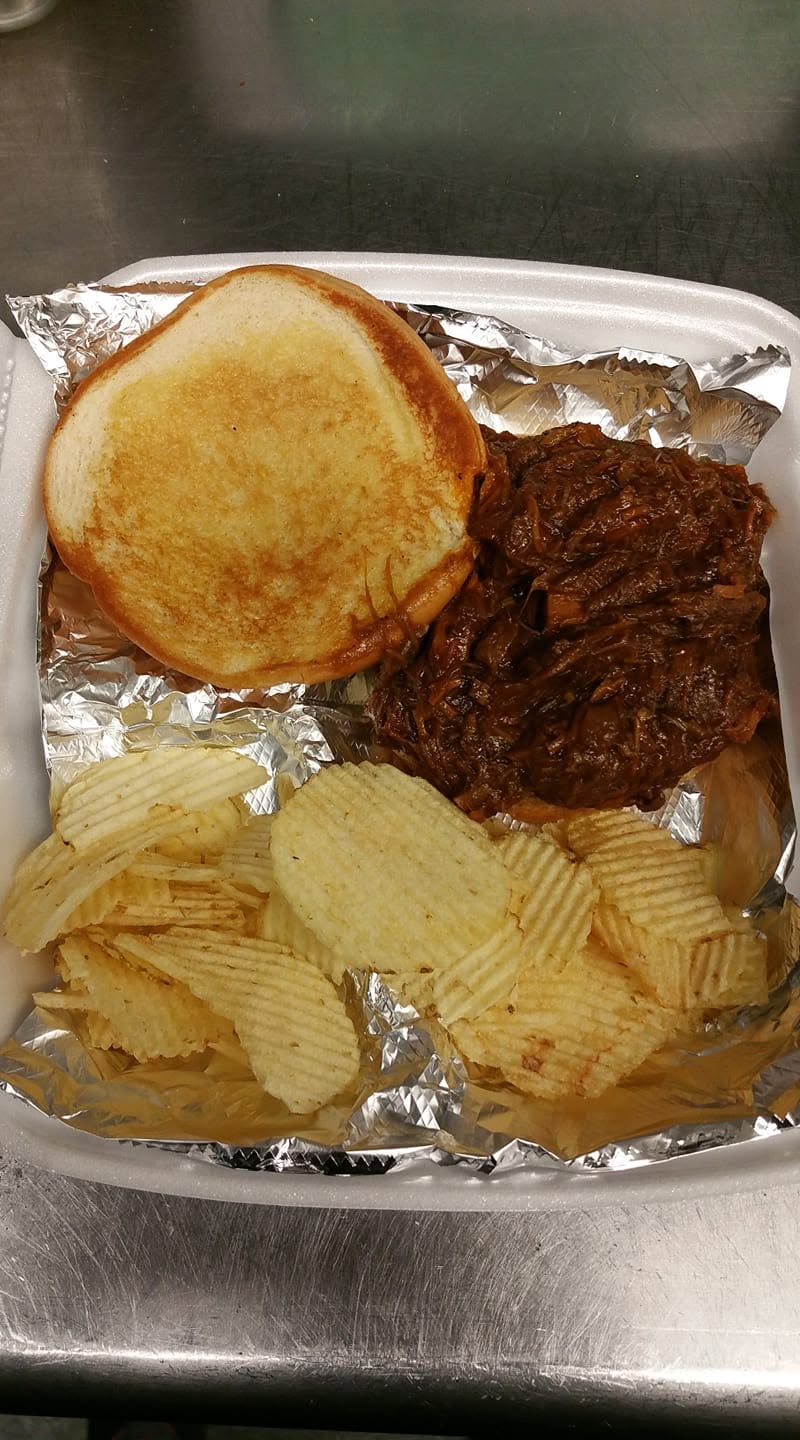 Pulled BBQ pork sandwich with chips at Bev's Restaurant