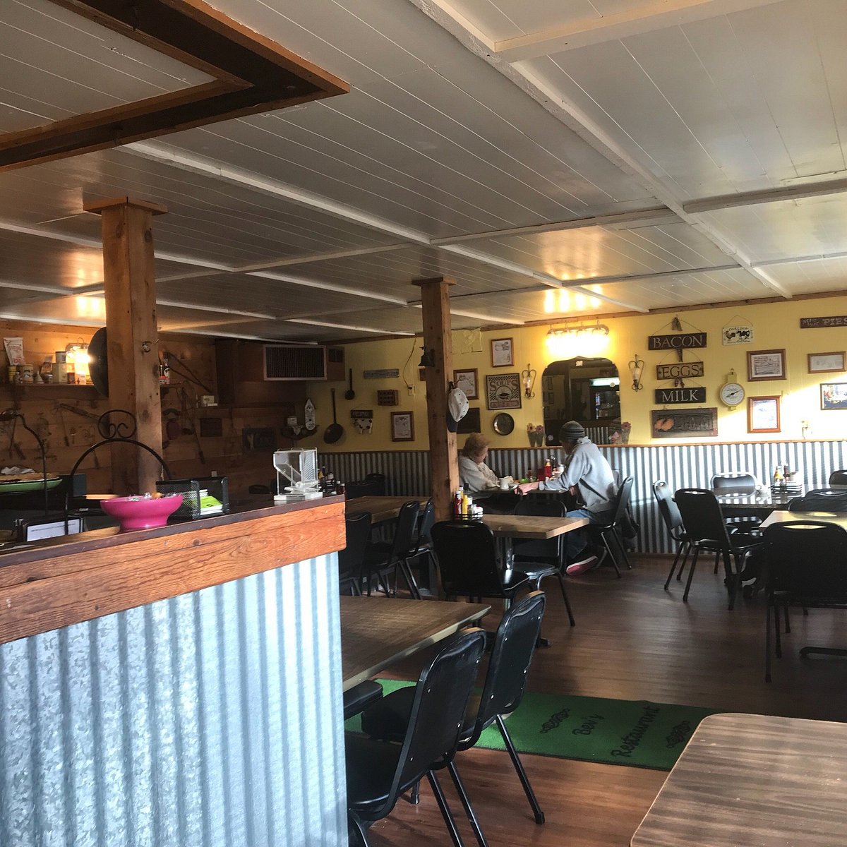 Inside Bev's Restaurant — the cozy dining room with rustic wood beams and country decor in Terre Haute